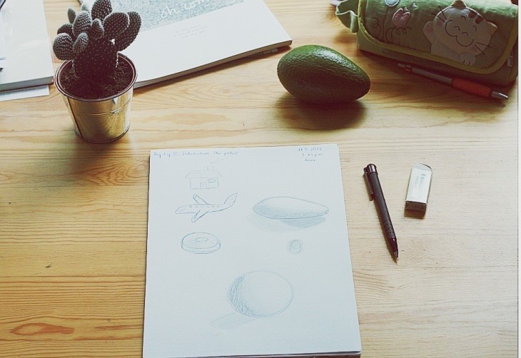 There's the avocado I based on to draw (unrecognizable on the paper I drew, of course...) and the cactus pot I used to get the circle. : p